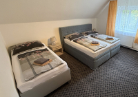 Třílůžkový apartmán ložnice